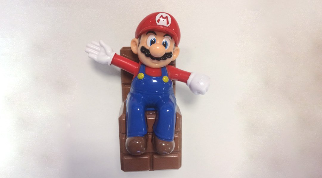 What Is Mario Sitting On In This McDonald's Toy?